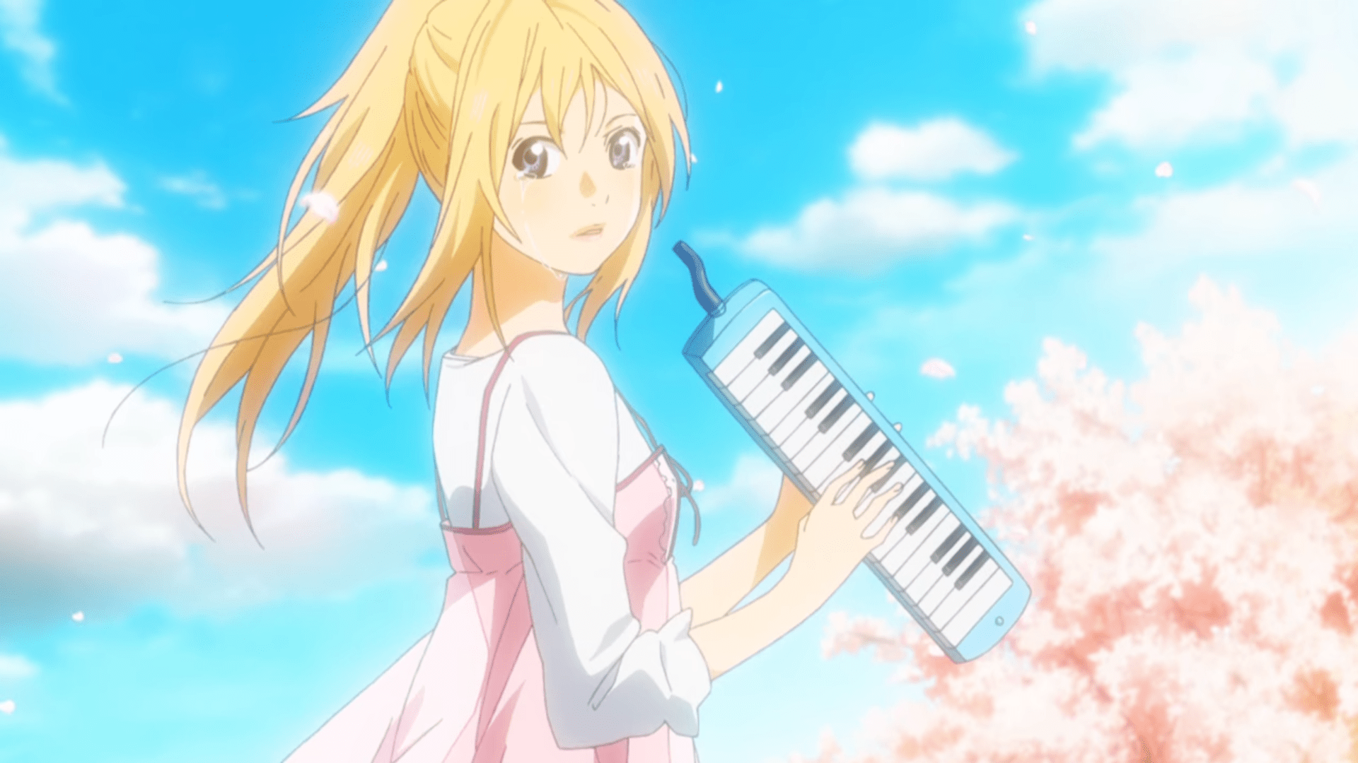 Miyazono, Kaori from Your Lie In April holds a melodica in her hands and stares toward the audience with tears falling from her eyes.